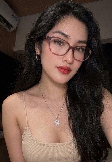 Woman with glasses and long dark hair